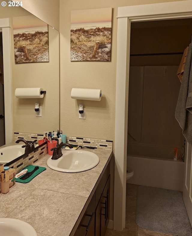 full bathroom with toilet, shower / bathing tub combination, and vanity