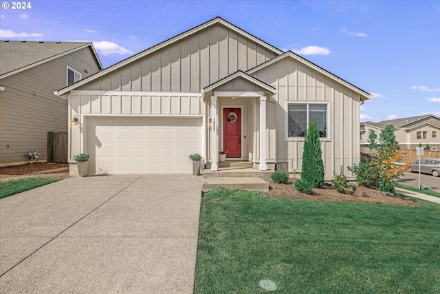 view of front of house featuring a garage and a front yard