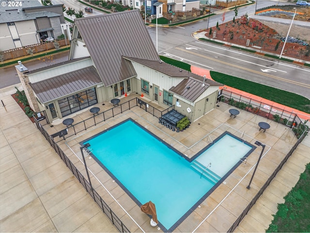 view of swimming pool with a patio area