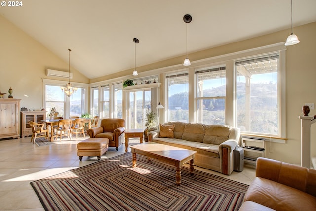 living room featuring a healthy amount of sunlight, light tile patterned flooring, and an inviting chandelier