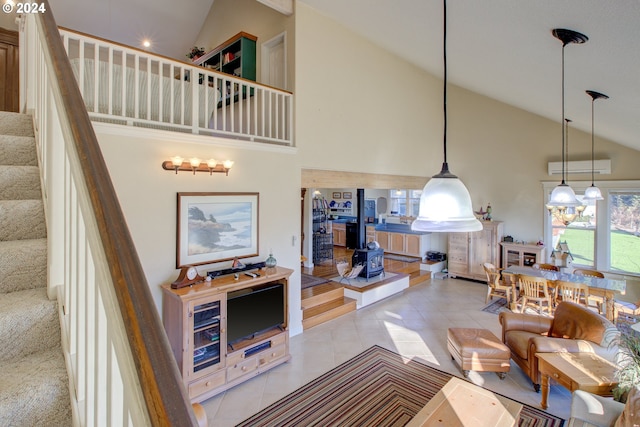 14115 N Bank Rd, Roseburg, OR 97470 - living room featuring high vaulted ceiling, plenty of natural light, stairway, and light tile patterned floors