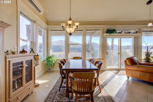 14115 N Bank Rd, Roseburg, OR 97470 - dining area featuring light tile patterned floors, plenty of natural light, a chandelier, a wall mounted air conditioner, and vaulted ceiling