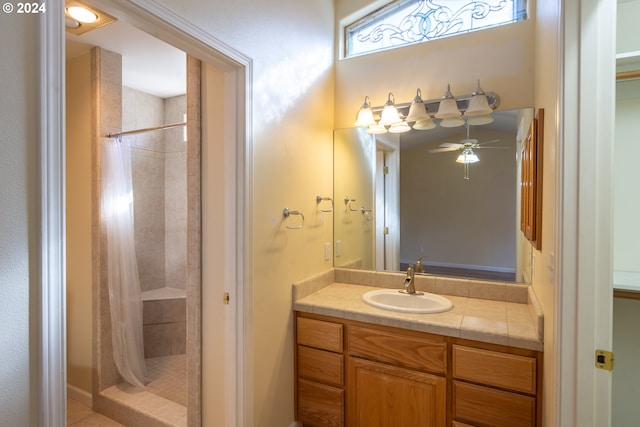 bathroom featuring vanity, ceiling fan, and a shower with shower curtain