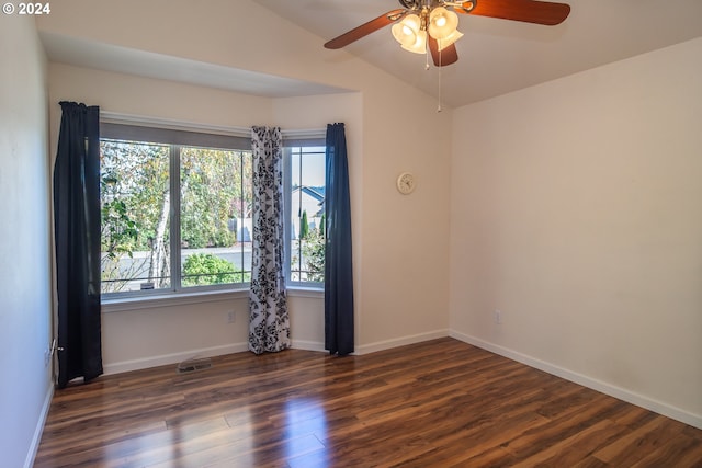 unfurnished room featuring lofted ceiling, dark wood-type flooring, and ceiling fan