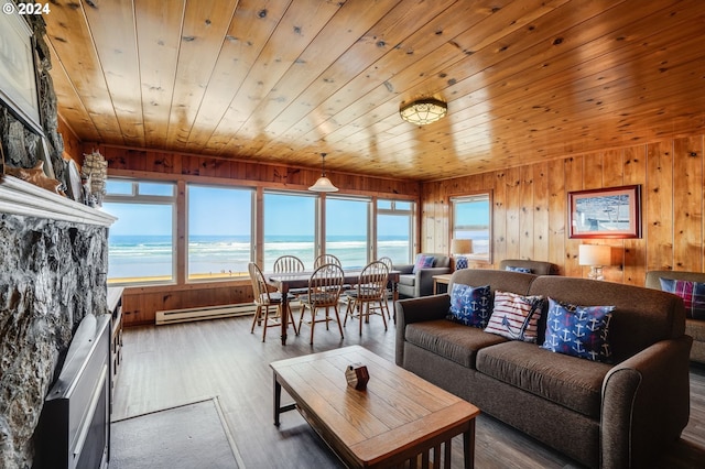 living room with wooden ceiling, a water view, wood walls, and dark hardwood / wood-style floors