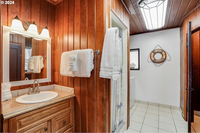 bathroom with vanity, wood walls, tile patterned floors, and wooden ceiling