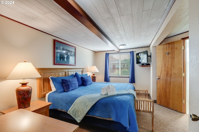 bedroom featuring wooden ceiling and carpet floors