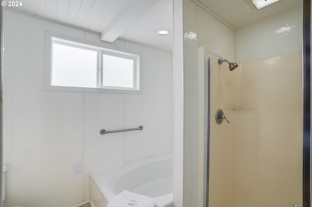 bathroom featuring a bathing tub and a shower with shower door