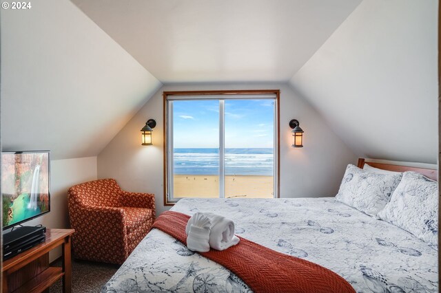 carpeted bedroom with vaulted ceiling, a water view, and access to exterior