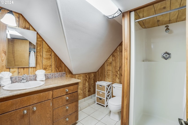 full bath with a shower stall, wood walls, vanity, toilet, and lofted ceiling