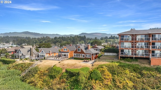 exterior space with a residential view and a mountain view