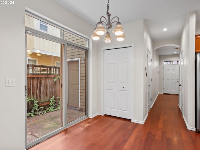 15771 SW Harvester Ln, Sherwood, OR 97140 - foyer featuring arched walkways, dark wood finished floors, a chandelier, recessed lighting, and baseboards