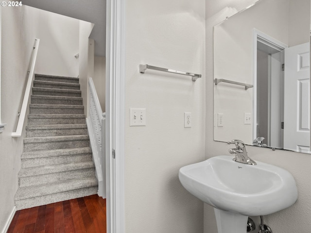 bathroom with wood-type flooring and sink