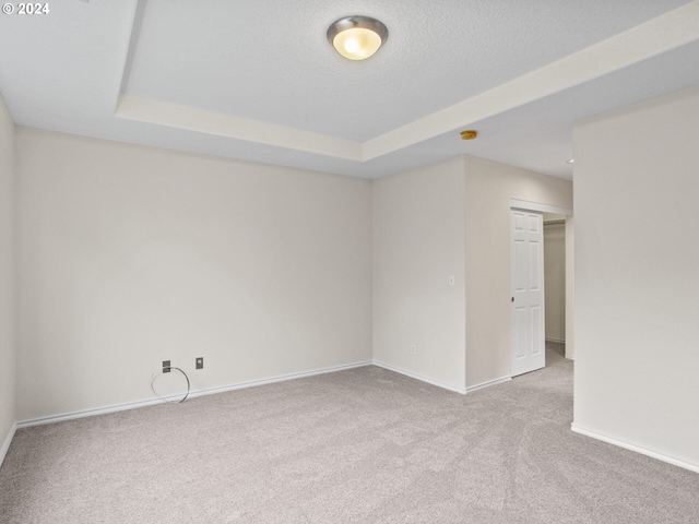 15771 SW Harvester Ln, Sherwood, OR 97140 - empty room with carpet, baseboards, a tray ceiling, and a textured ceiling