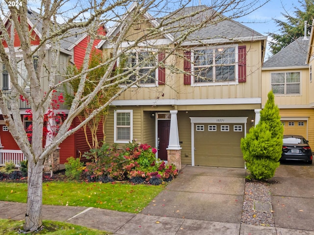 view of front of property with a front lawn and a garage