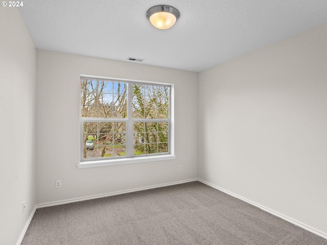 15771 SW Harvester Ln, Sherwood, OR 97140 - empty room with carpet floors, baseboards, and a textured ceiling