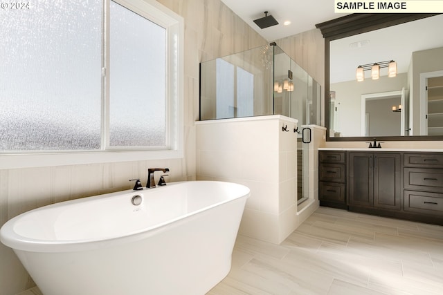 bathroom featuring vanity, tile floors, independent shower and bath, and a wealth of natural light