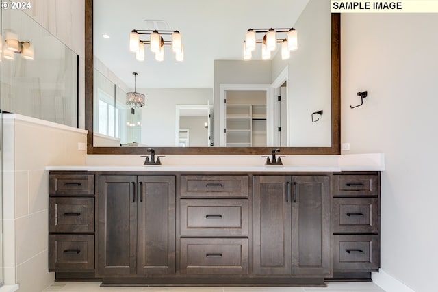 bathroom featuring tile walls and vanity