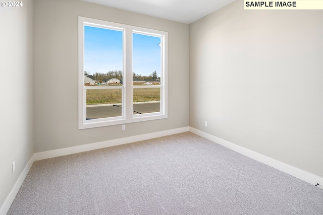 empty room with light colored carpet