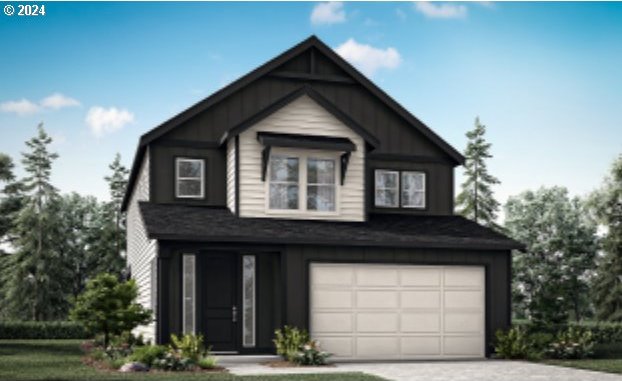 view of front of house with a front lawn and a garage