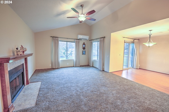 unfurnished living room with vaulted ceiling, hardwood / wood-style flooring, a wall unit AC, and ceiling fan