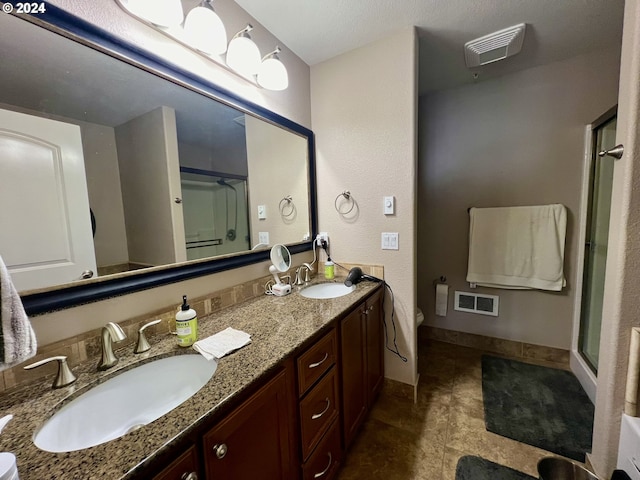 bathroom featuring vanity and walk in shower