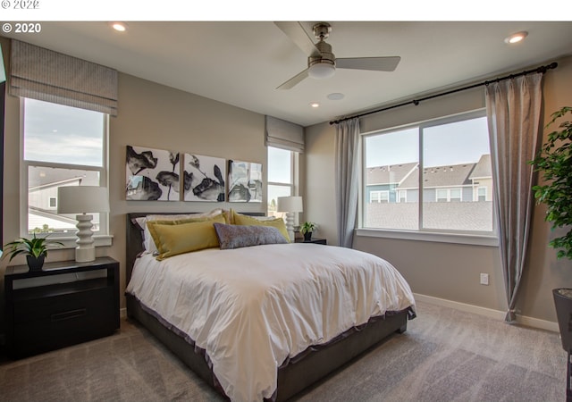 carpeted bedroom featuring ceiling fan