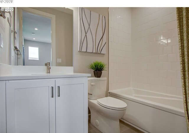 full bathroom with tile patterned floors, vanity, toilet, and shower / tub combo with curtain