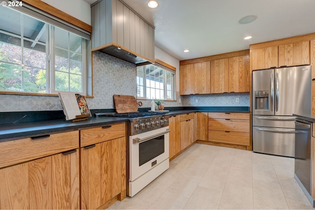 kitchen featuring stainless steel fridge with ice dispenser, backsplash, premium range hood, and high end white range oven