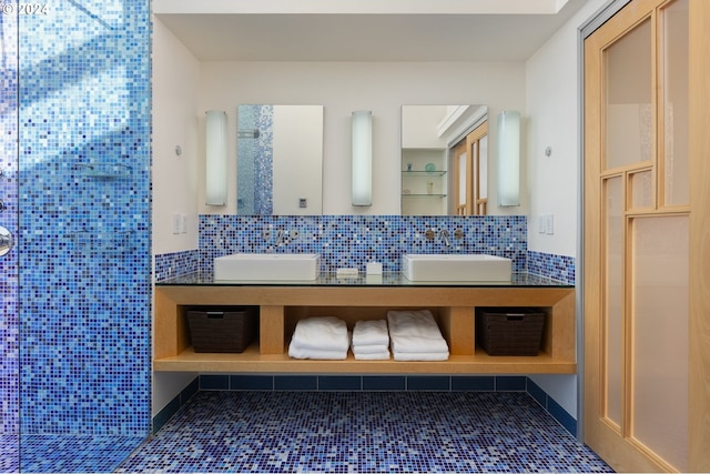 bathroom featuring vanity, tile patterned floors, and tile walls