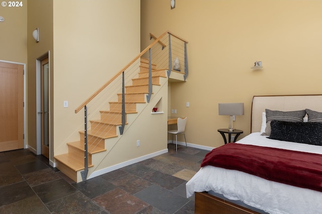 bedroom featuring a high ceiling