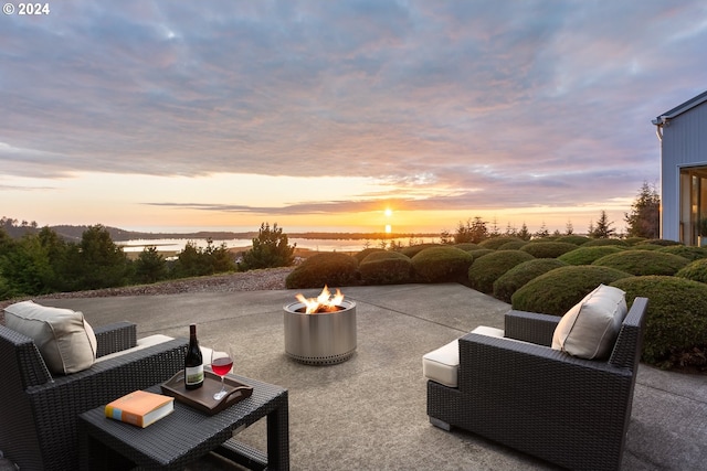 patio terrace at dusk with a fire pit