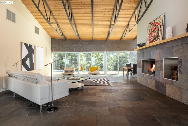 living room with beamed ceiling, wood ceiling, and high vaulted ceiling