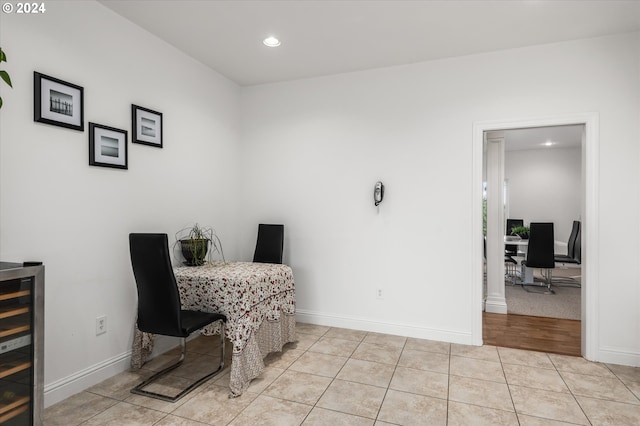 tiled dining space featuring wine cooler