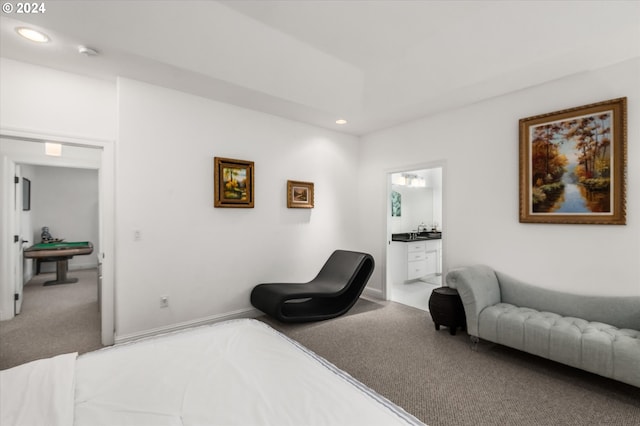 carpeted bedroom featuring ensuite bathroom