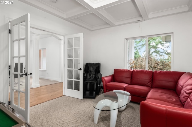 living room with carpet, french doors, beamed ceiling, and coffered ceiling