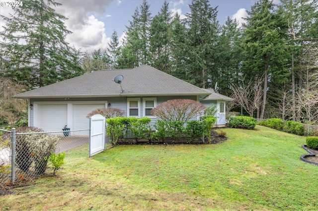 exterior space with a front lawn and a garage