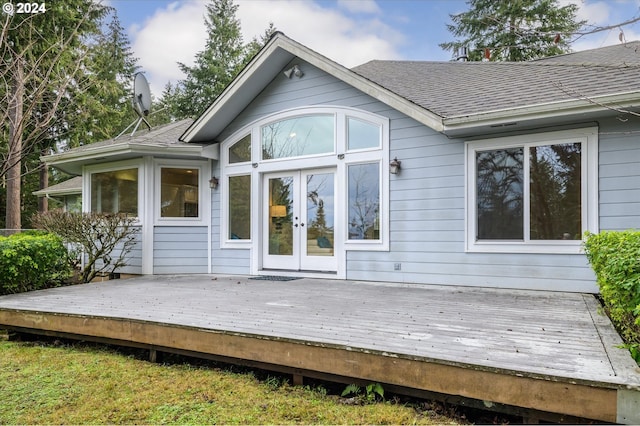 rear view of property with french doors and a deck