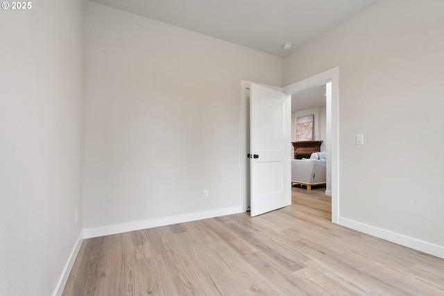 spare room featuring light hardwood / wood-style flooring