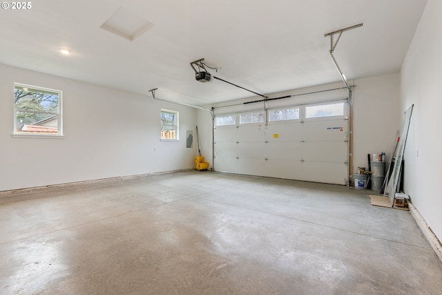 garage featuring a garage door opener and electric panel