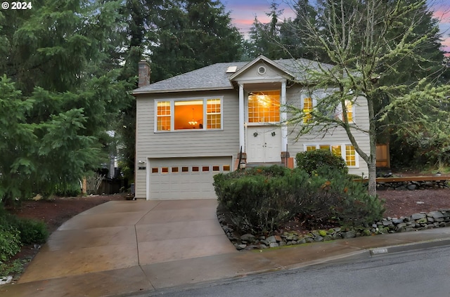 raised ranch featuring a garage