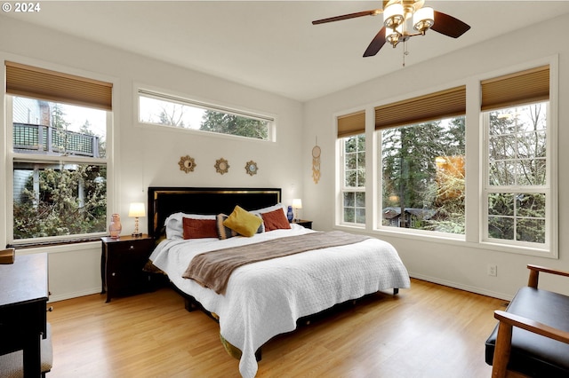 bedroom featuring ceiling fan and light hardwood / wood-style flooring