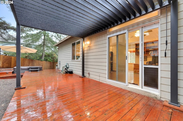 deck featuring a hot tub