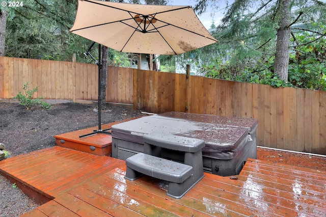 wooden terrace with a hot tub