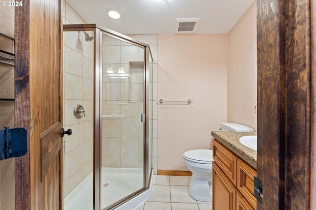 full bath featuring a stall shower, vanity, visible vents, and tile patterned floors