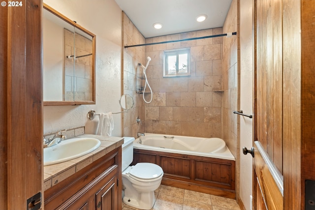 full bathroom with shower / bathtub combination, a textured wall, toilet, vanity, and tile patterned floors