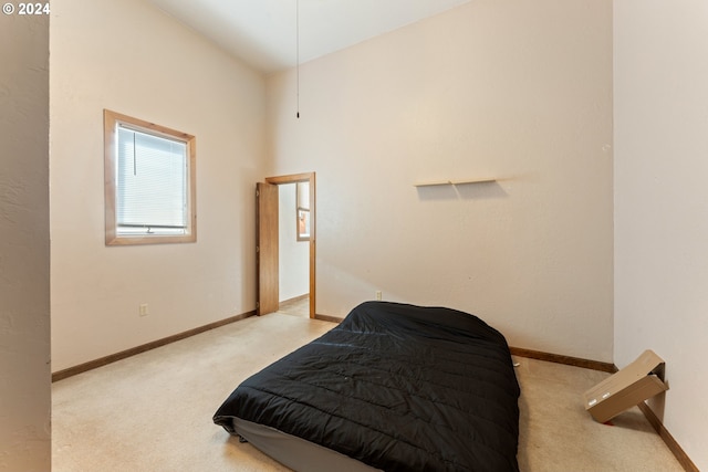 carpeted bedroom featuring baseboards