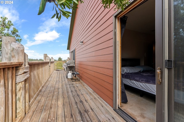 wooden terrace with area for grilling