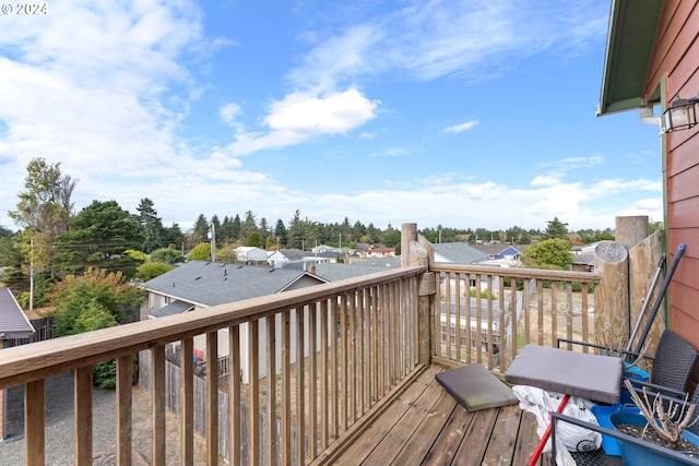 wooden terrace featuring a residential view