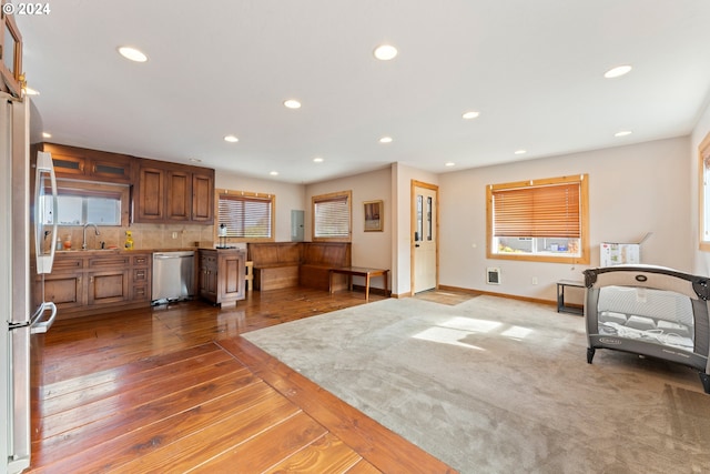 interior space featuring hardwood / wood-style flooring, plenty of natural light, baseboards, and recessed lighting